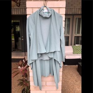 Etcetera cardigan & sleeveless turtleneck.